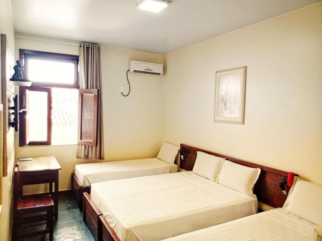 Postel nebo postele na pokoji v ubytování Hotel Monte Pascoal