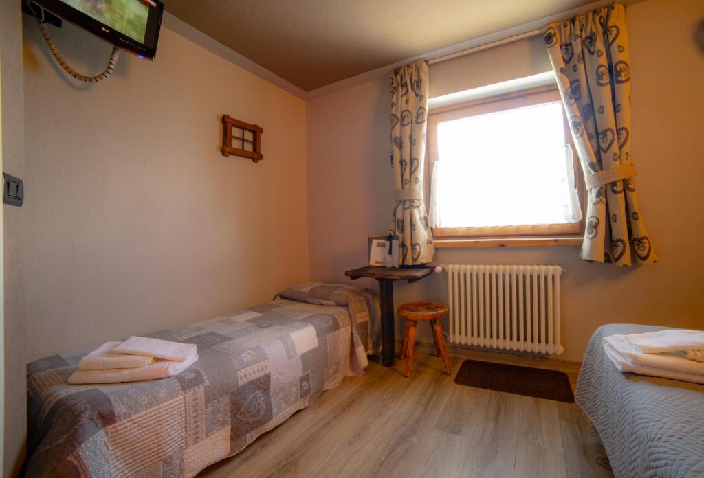 Postel nebo postele na pokoji v ubytování Hotel Chacaril