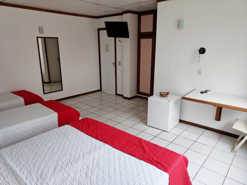 Postel nebo postele na pokoji v ubytování Hotel Portal De Eunápolis