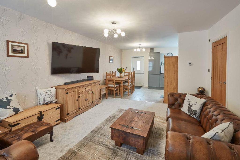a living room with a couch and a table at Host & Stay - No 5 Hoggarths Yard in Whitby