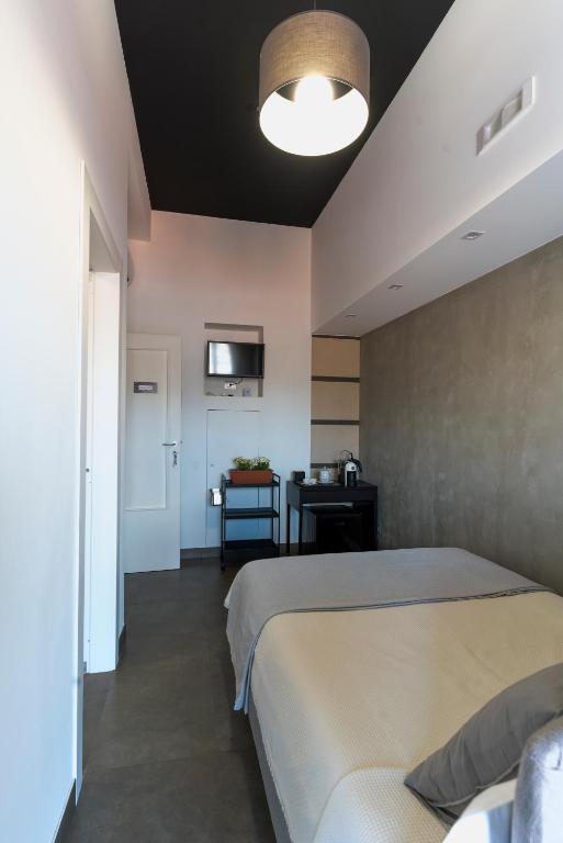 A bed or beds in a room at Florestine Napoli