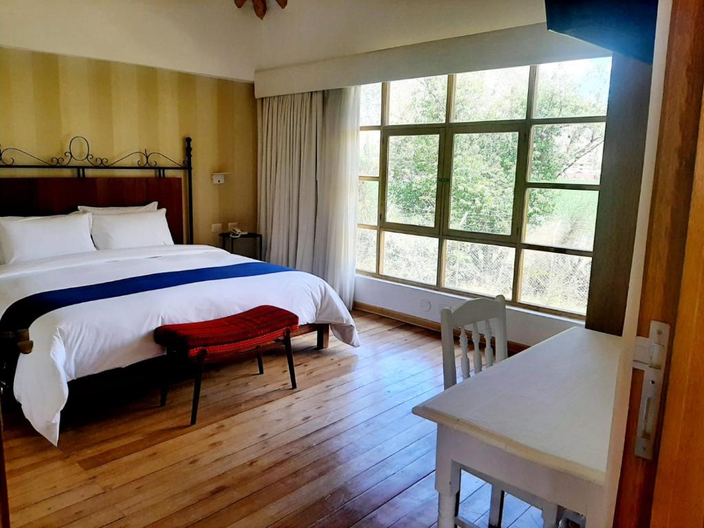 Postel nebo postele na pokoji v ubytování Hotel La Casona De Yucay Valle Sagrado