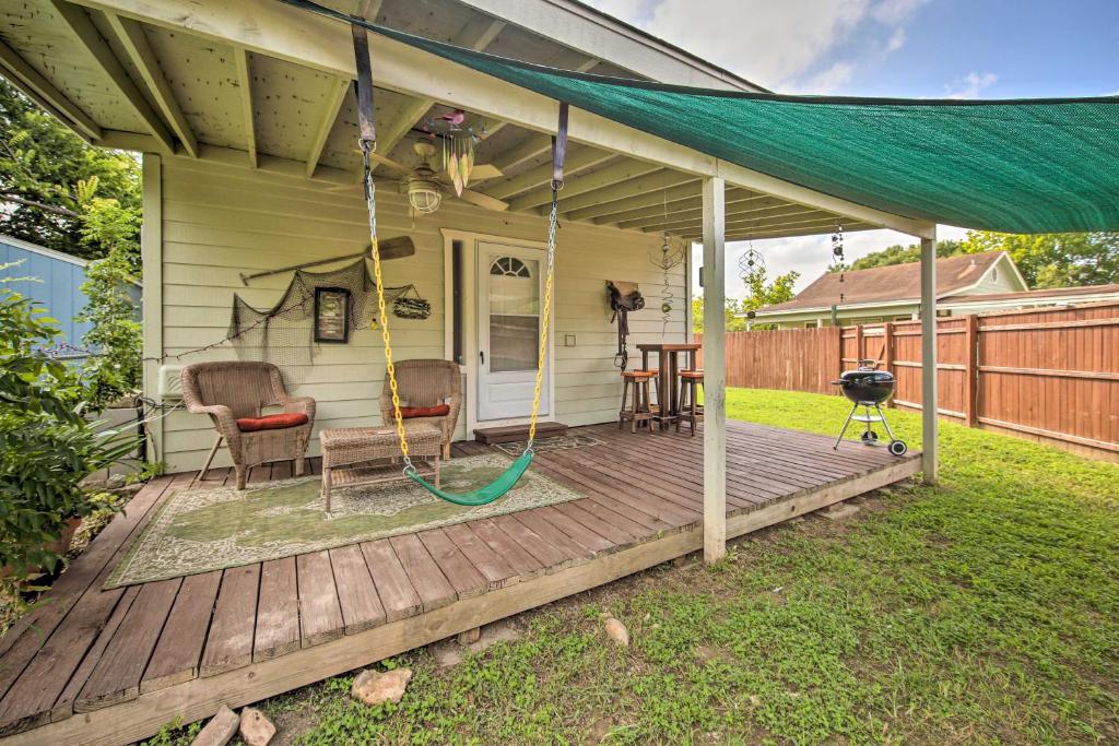a porch with a hammock and chairs on a deck at Pet-Friendly Canyon Lake Studio Fish, Boat, Relax in Canyon Lake