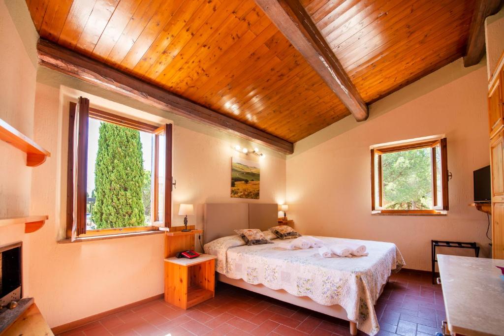 Postel nebo postele na pokoji v ubytování Hotel Palazzuolo