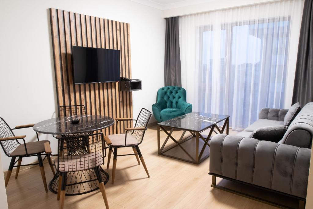 A television and/or entertainment centre at INN HOUSE LOFT SPA