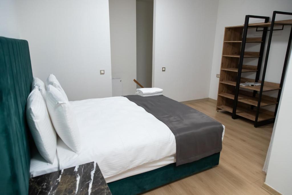 A bed or beds in a room at INN HOUSE LOFT SPA