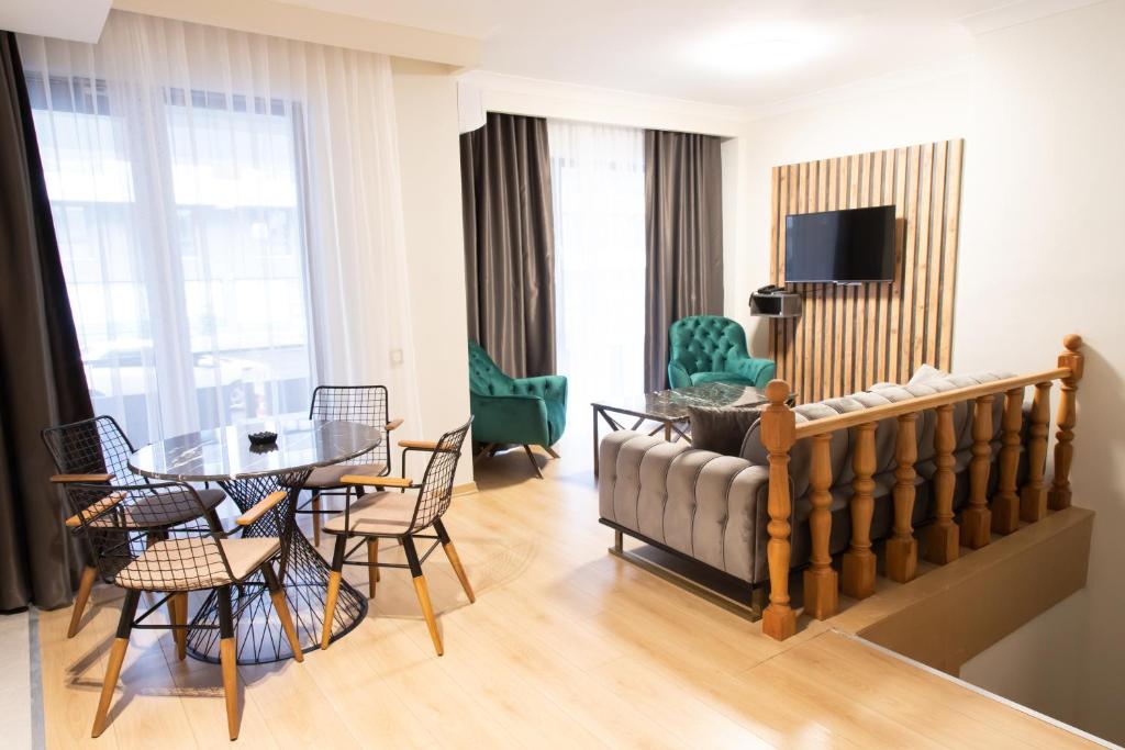 A television and/or entertainment centre at INN HOUSE LOFT SPA