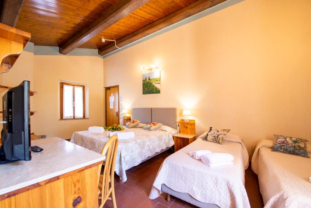 Postel nebo postele na pokoji v ubytování Hotel Palazzuolo