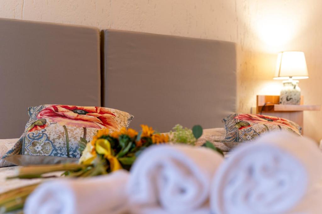 Postel nebo postele na pokoji v ubytování Hotel Palazzuolo