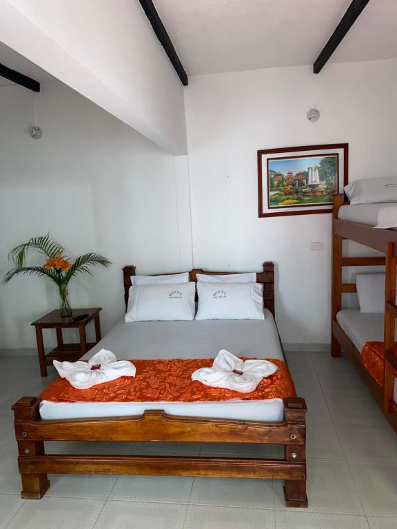 Postel nebo postele na pokoji v ubytování Hotel Paso Realce