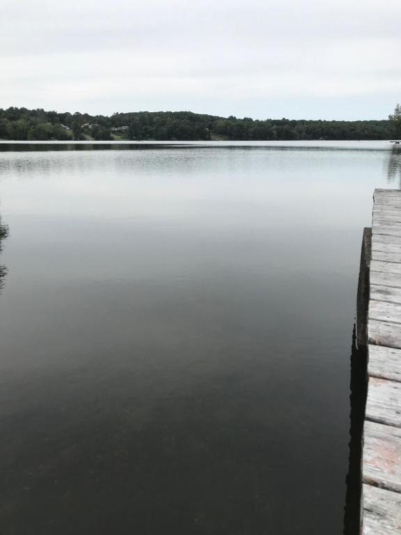 a view of a large body of water with a dock at Reel Simple Bolton Lake Cottage in Bolton