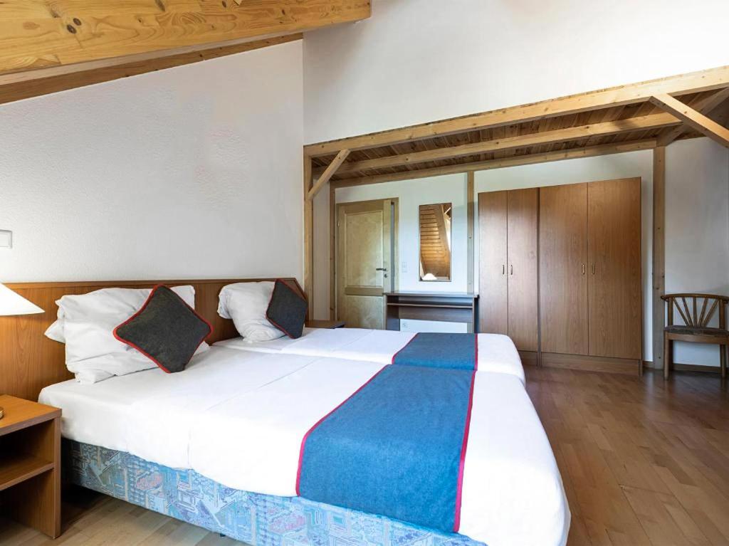 Postel nebo postele na pokoji v ubytování Hotel Bohemia