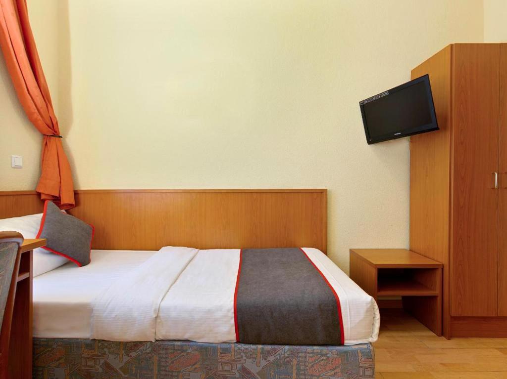 Postel nebo postele na pokoji v ubytování Hotel Bohemia