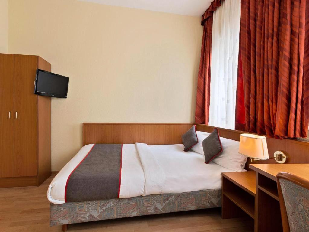 Postel nebo postele na pokoji v ubytování Hotel Bohemia