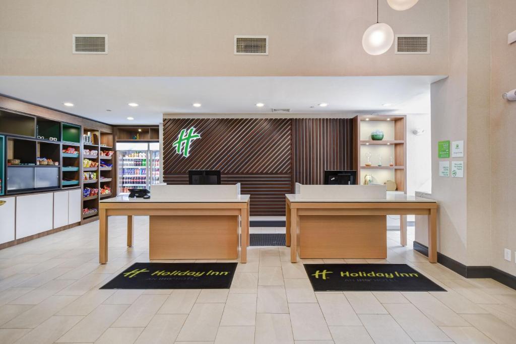 a store with two tables in a room at Holiday Inn Allentown-Bethlehem by IHG in Allentown