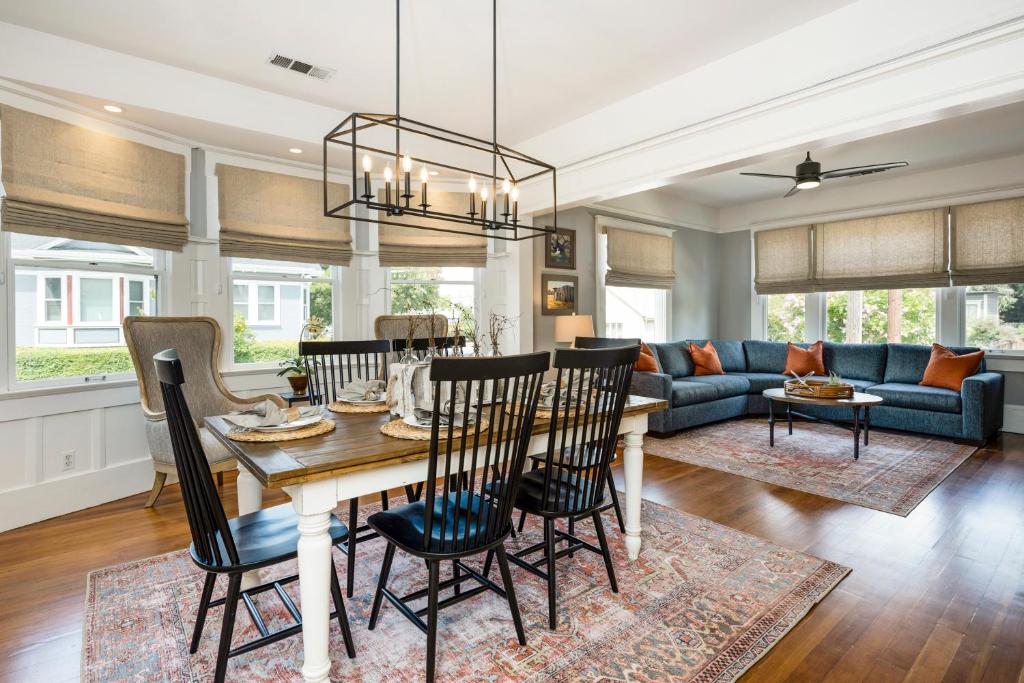 a dining room and living room with a table and chairs at The Main Street House - Designer Napa Home in Napa