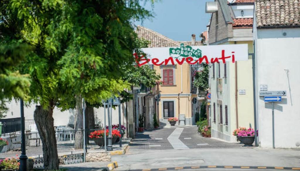a street in a town with a sign that reads severant at La Casa al Colle in Treglio