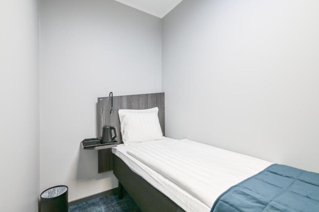 Postel nebo postele na pokoji v ubytování Hotel Fridhem