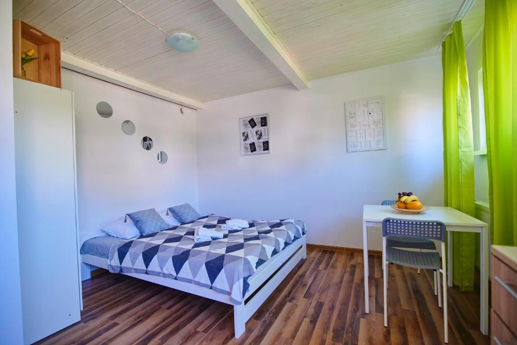 Posteľ alebo postele v izbe v ubytovaní Regem Apartments Płońska