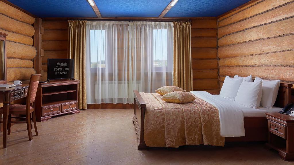 Postel nebo postele na pokoji v ubytování HOT SPRINGS