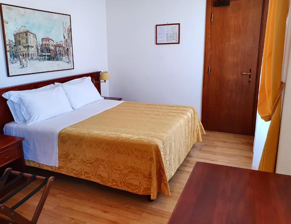 Posteľ alebo postele v izbe v ubytovaní Hotel Aurora