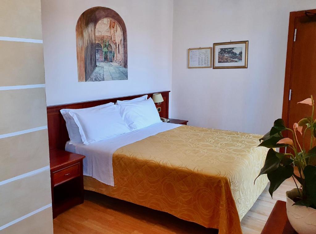 Posteľ alebo postele v izbe v ubytovaní Hotel Aurora