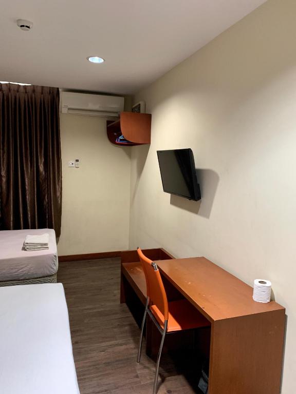 TV a/nebo společenská místnost v ubytování New Grand Hotel
