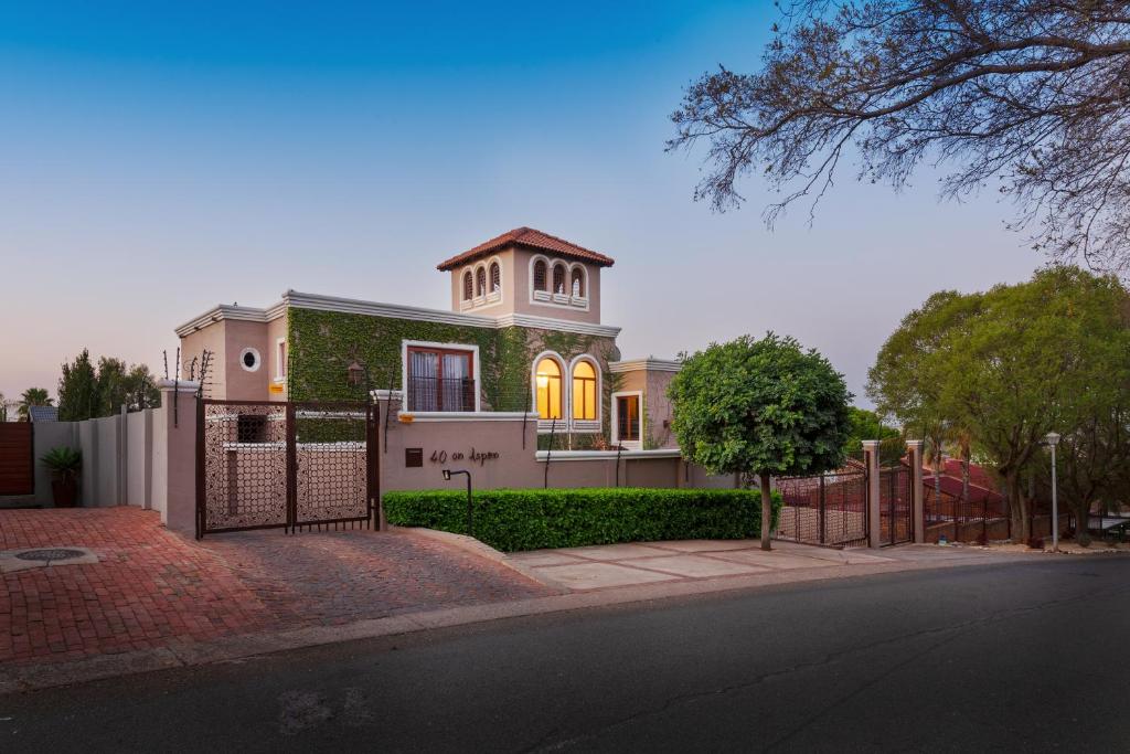 a house with a gate in front of it at 40 on Aspen in Centurion