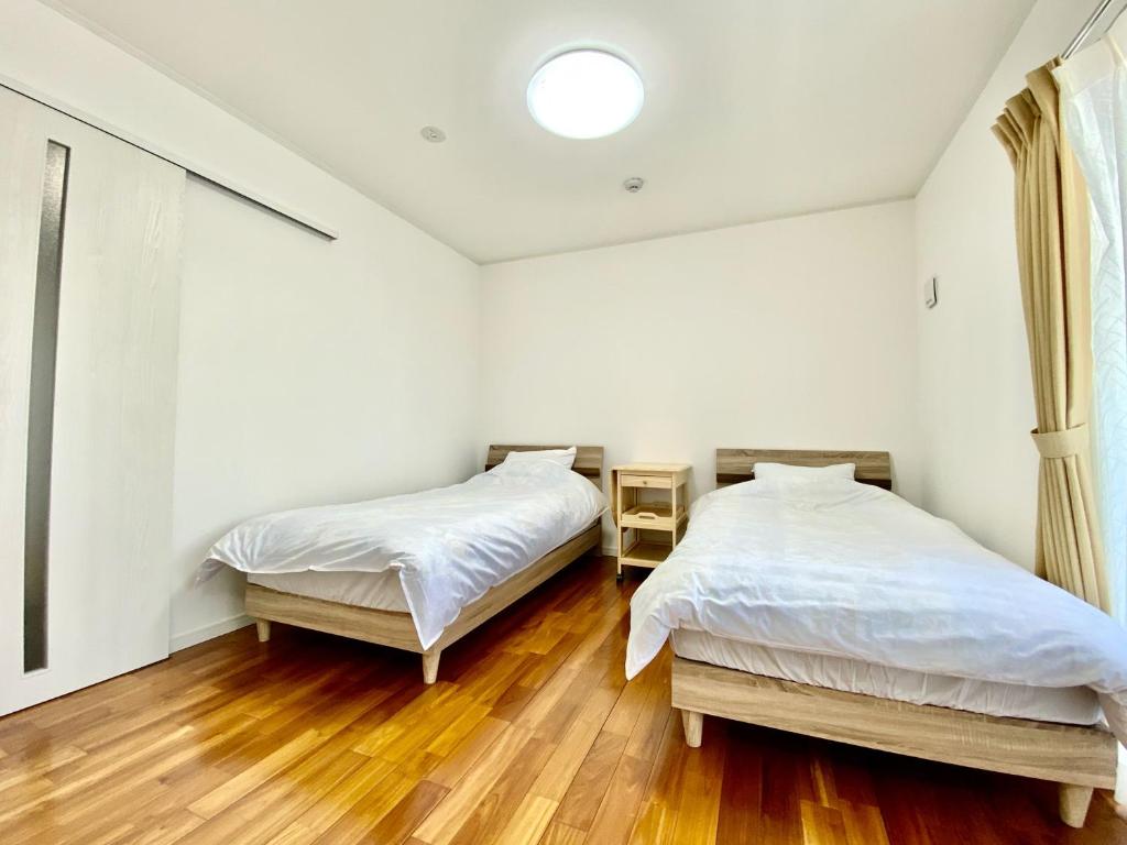 Postel nebo postele na pokoji v ubytování M-Villaggio Miyakojima