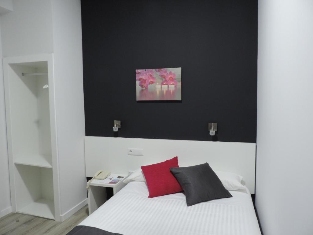 Postel nebo postele na pokoji v ubytování Hotel Junquera