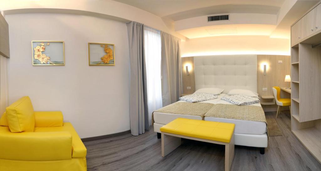 Postel nebo postele na pokoji v ubytování Hotel Orchidea
