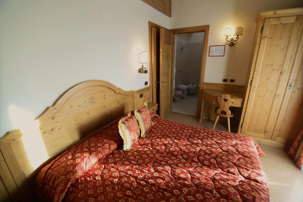 Postel nebo postele na pokoji v ubytování Albergo Valbella