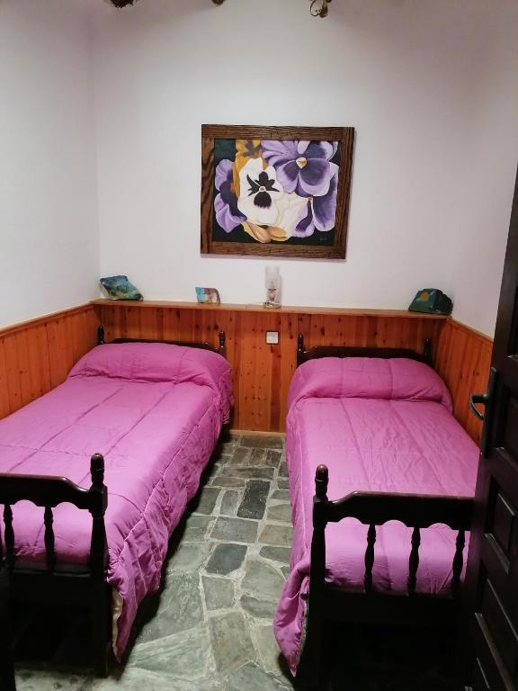Posteľ alebo postele v izbe v ubytovaní Casa Rural Arcoiris