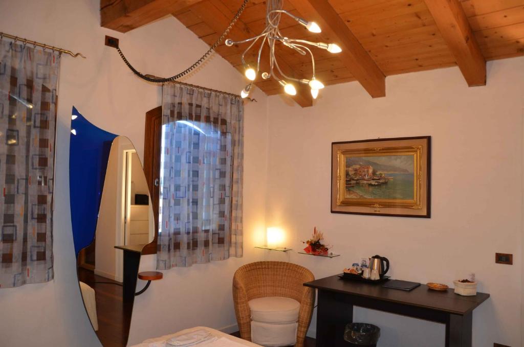 Postel nebo postele na pokoji v ubytování B&B Melograno MC