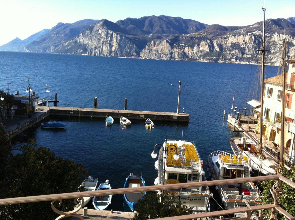 a view of a marina with boats in the water at charmante apartament lake front in Malcesine