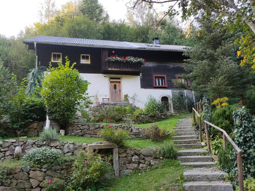 a house with a stone path leading to it at Alte Hammerschmiede in Sankt Aegidi