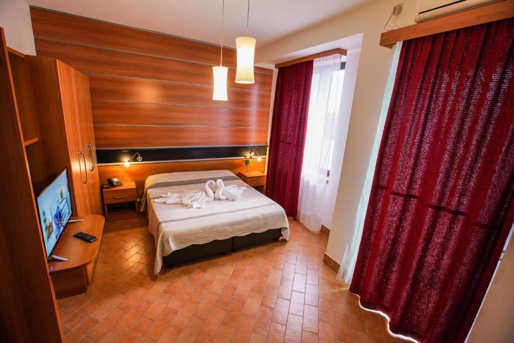 Postel nebo postele na pokoji v ubytování Hotel Murgia