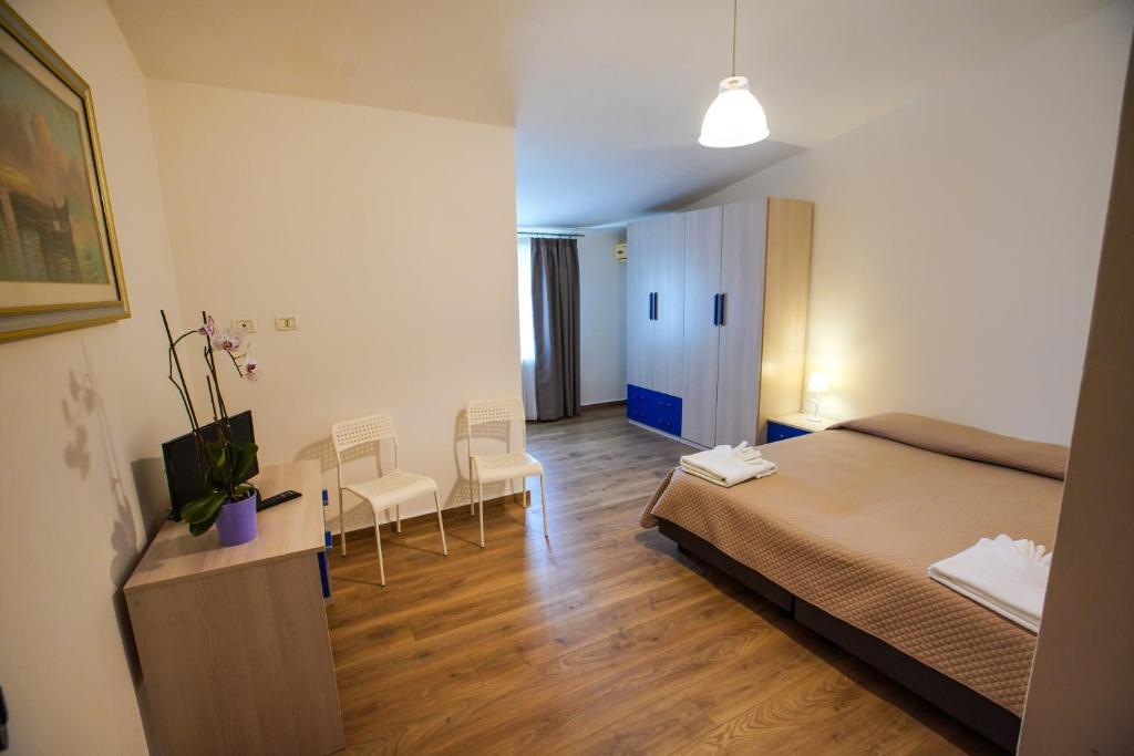 Postel nebo postele na pokoji v ubytování Hotel Murgia
