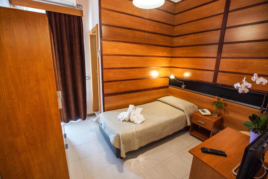 Postel nebo postele na pokoji v ubytování Hotel Murgia