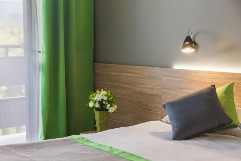 Postel nebo postele na pokoji v ubytování Hotel Vesna