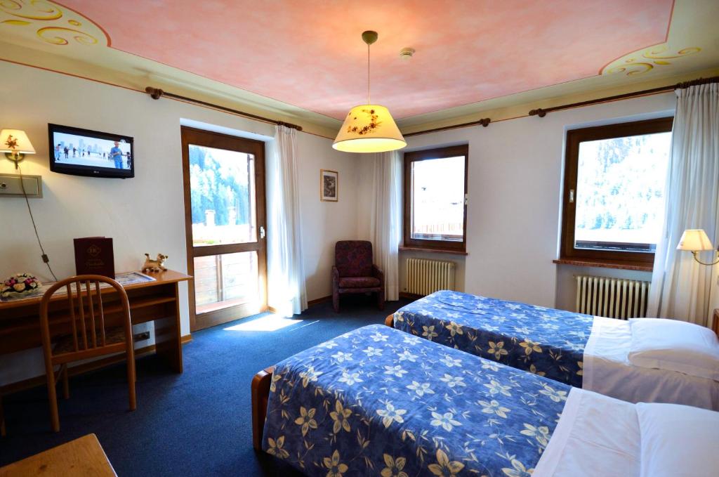 Postel nebo postele na pokoji v ubytování Hotel Centrale