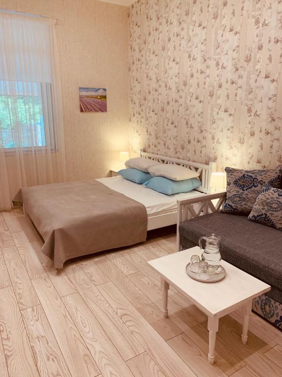 Postel nebo postele na pokoji v ubytování WINE & ROSE BOUTIQUE HOTEL