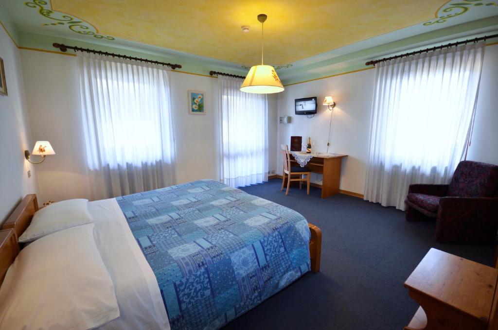 Postel nebo postele na pokoji v ubytování Hotel Centrale