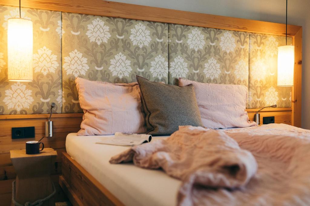 Postel nebo postele na pokoji v ubytování Boutique Hotel Das Rivus