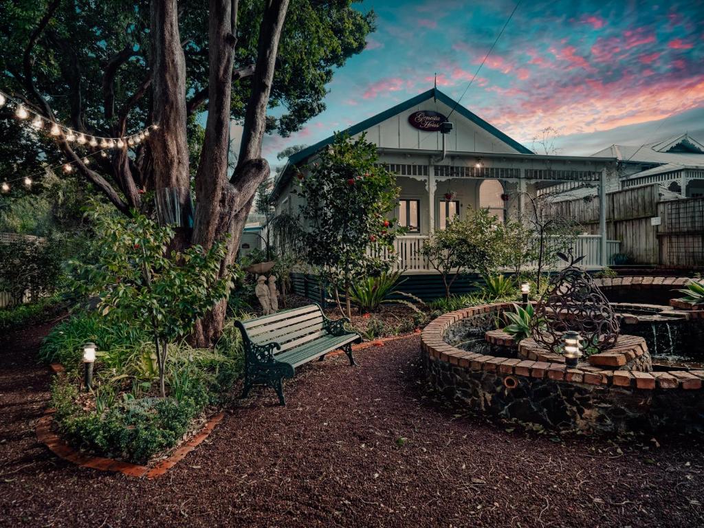 a park bench in front of a house at Genesta House in Cowes