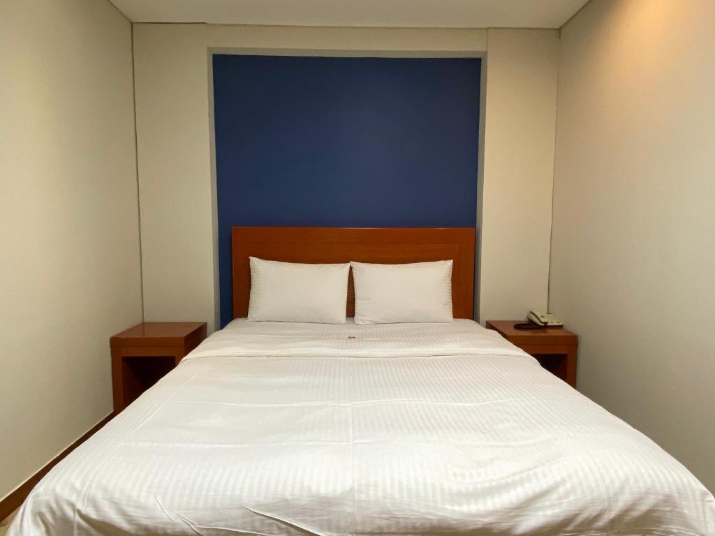 Postel nebo postele na pokoji v ubytování Benikea Daelim Hotel