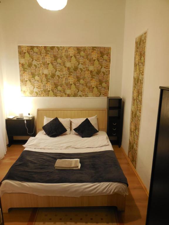 Ліжко або ліжка в номері Apartment near Rynok square