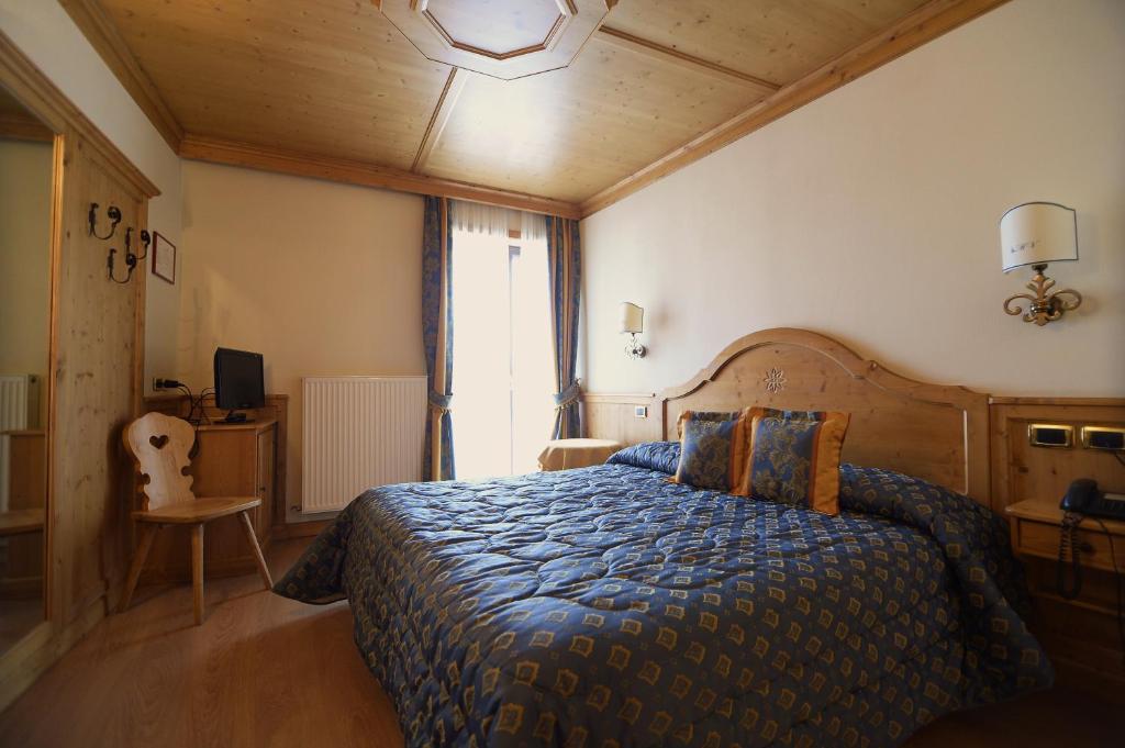 Postel nebo postele na pokoji v ubytování Albergo Valbella