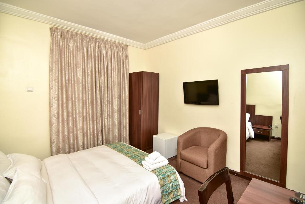 Postel nebo postele na pokoji v ubytování Sinclair Guest House