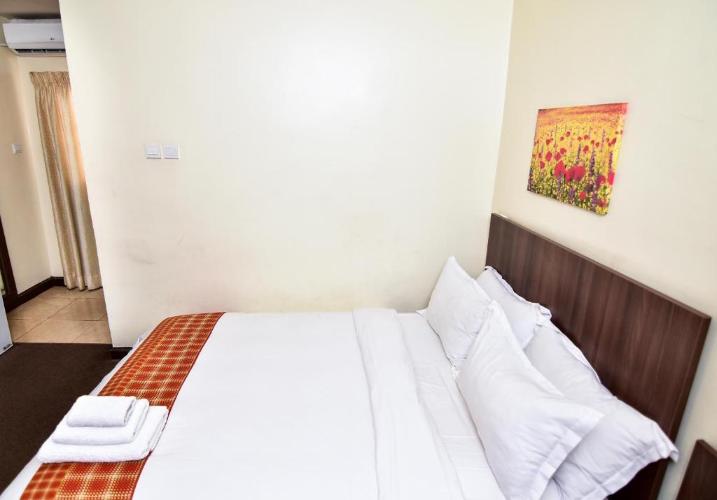 Postel nebo postele na pokoji v ubytování Sinclair Guest House